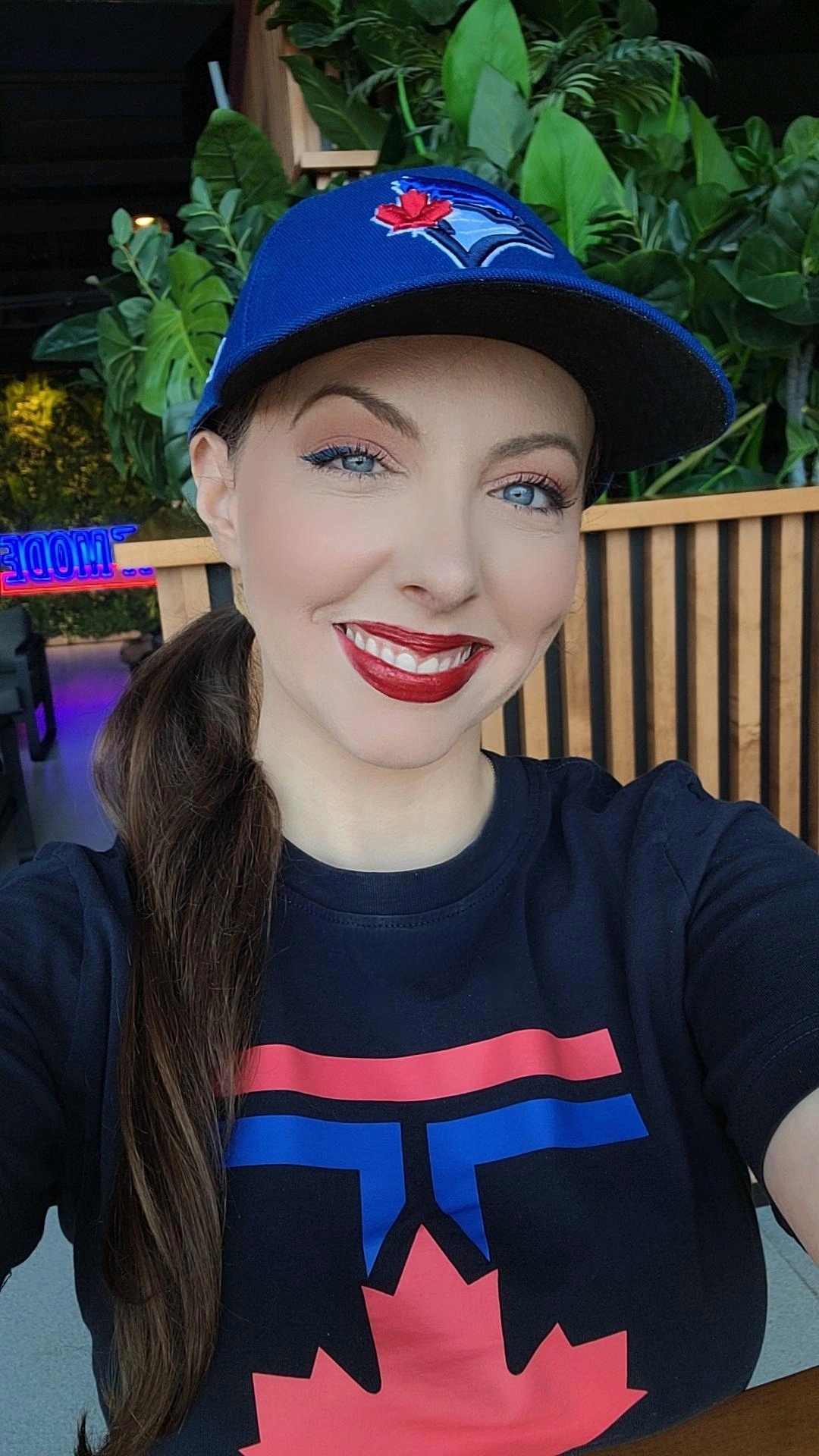 Toronto DJ Flavia Abadia aka Your Girl Flav wearing a Toronto Blue Jays Hat and City Connect T Shirt